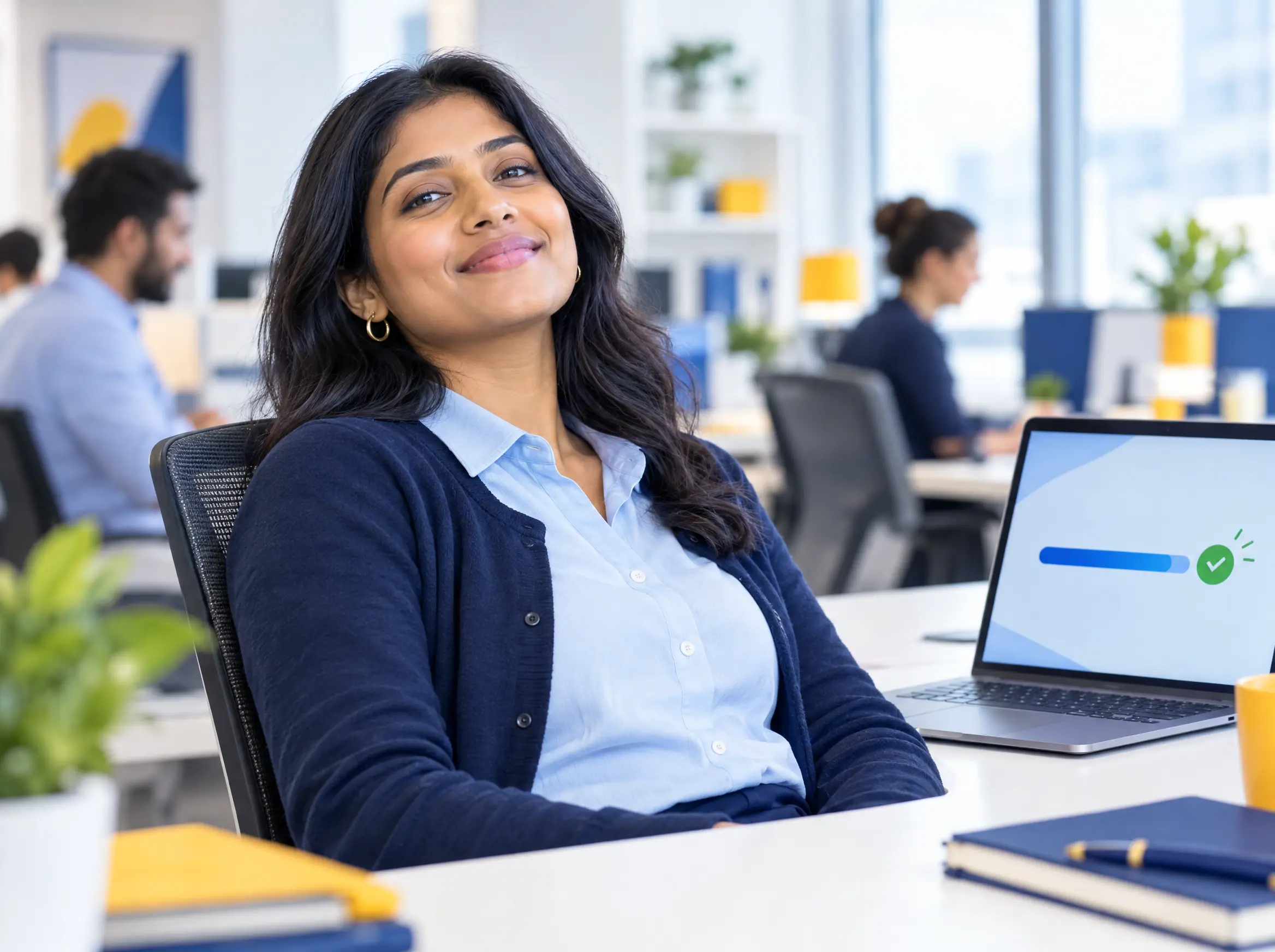 A billing specialist smiling after a batch of claims is accepted for submission